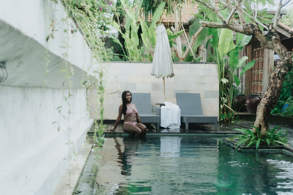 Tranquil Outdoor Swimming Pool Oasis with Sun Loungers at Rimbun Canggu Joglo Villas
